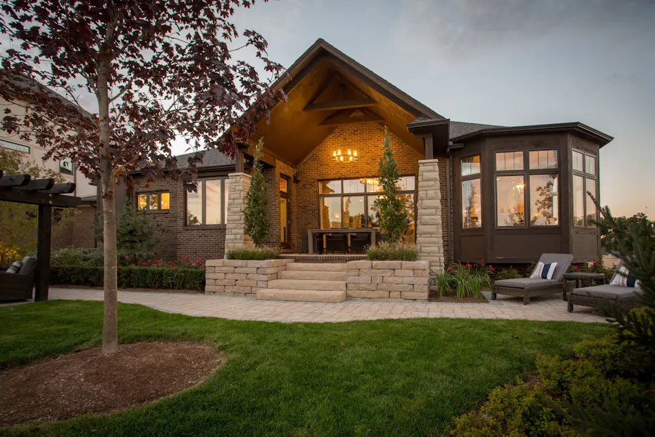 Columns and garden beds frame an entryway