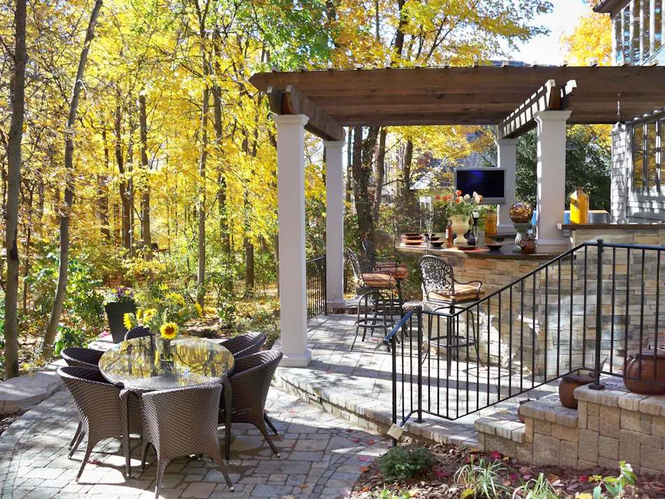 Backyard patio with outdoor dining table and chairs