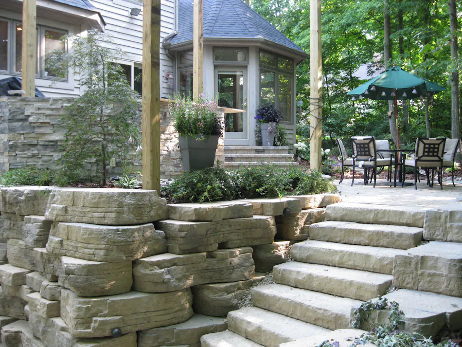 Outcropping and steps leading to backyard patio