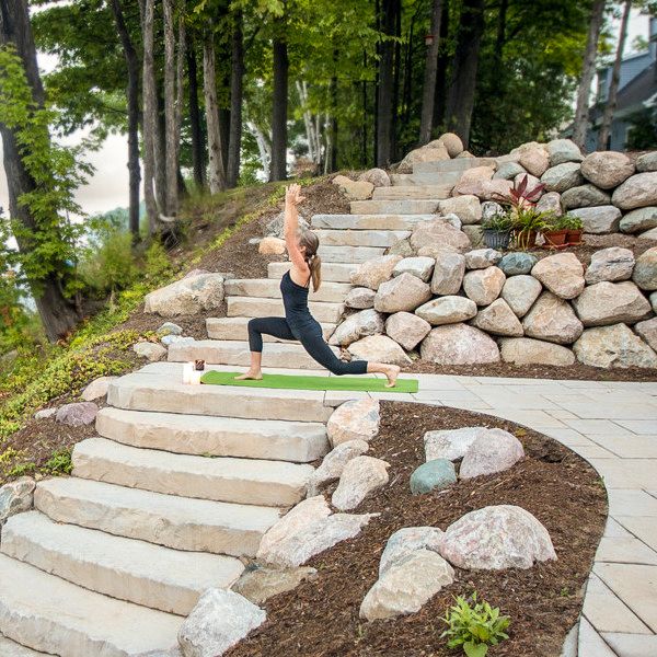 person doing yoga on pavers next to rosetta irregular steps
