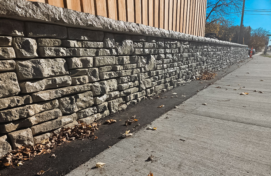 image of alpine textured novum wall along sidewalk