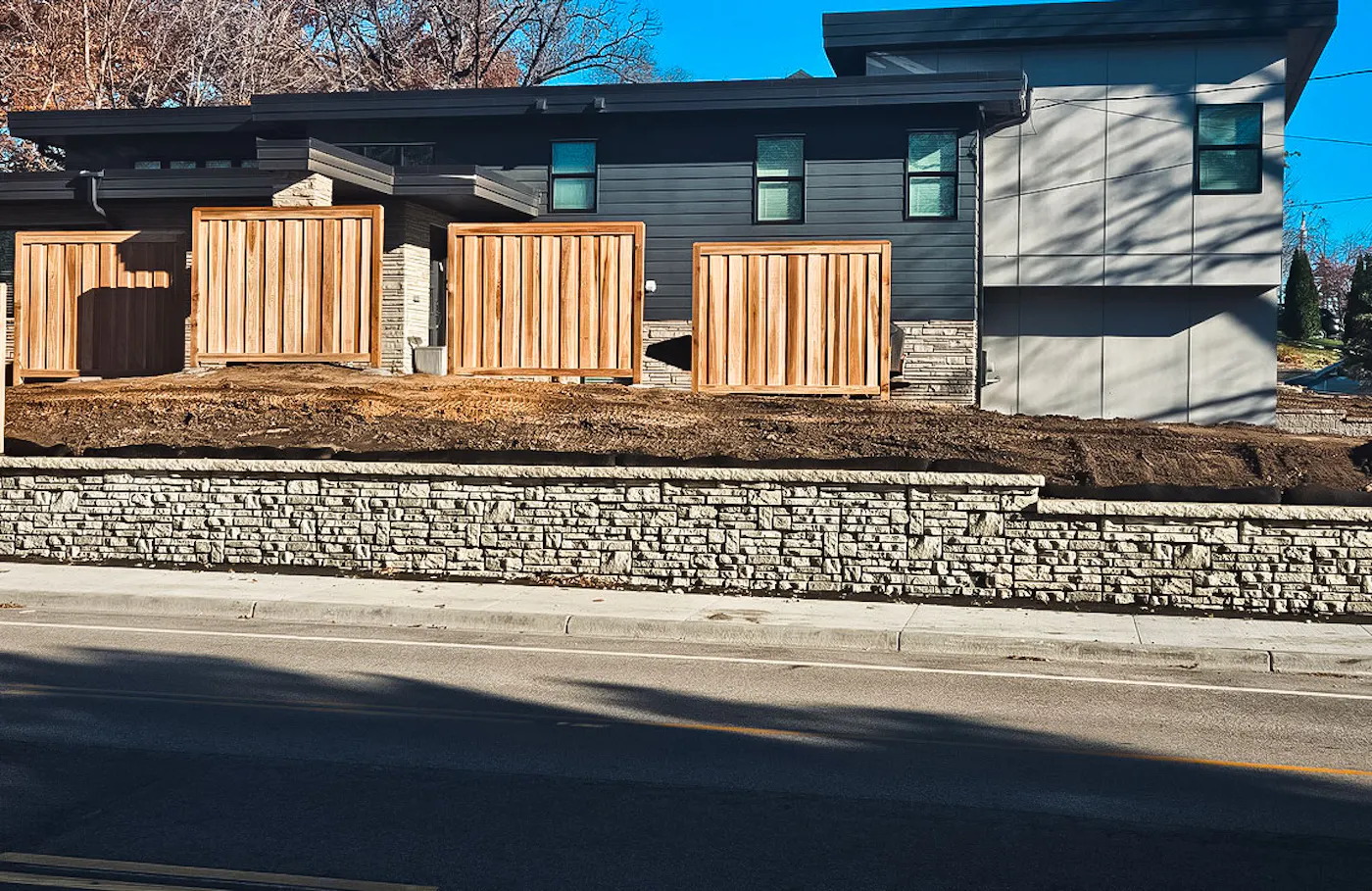 image of alpine textured novum wall along sidewalk