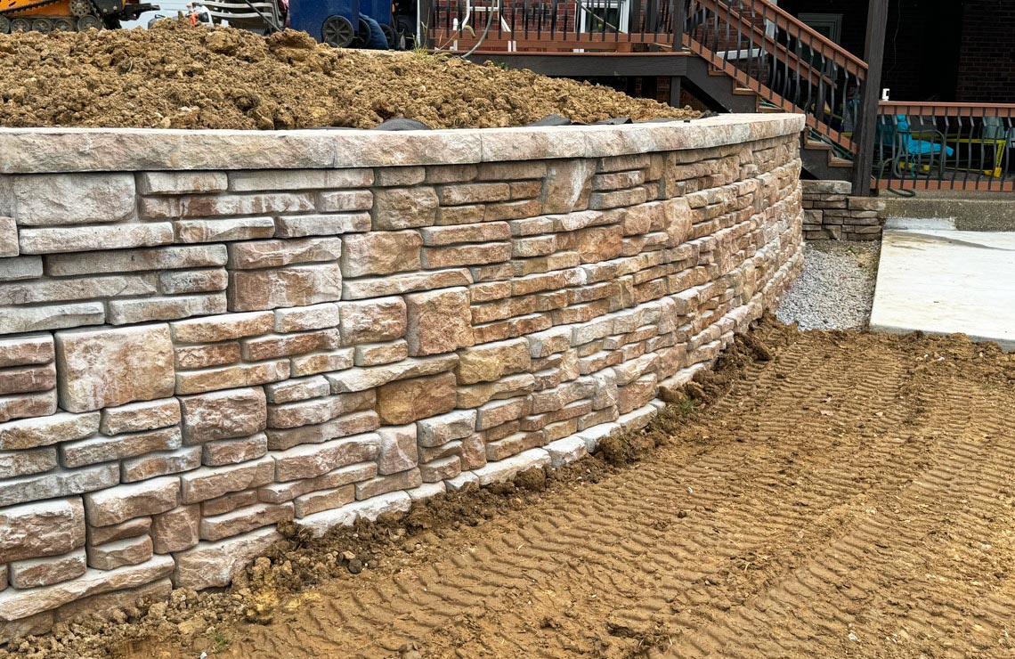 image of close up stained alpine textured novum wall in backyard