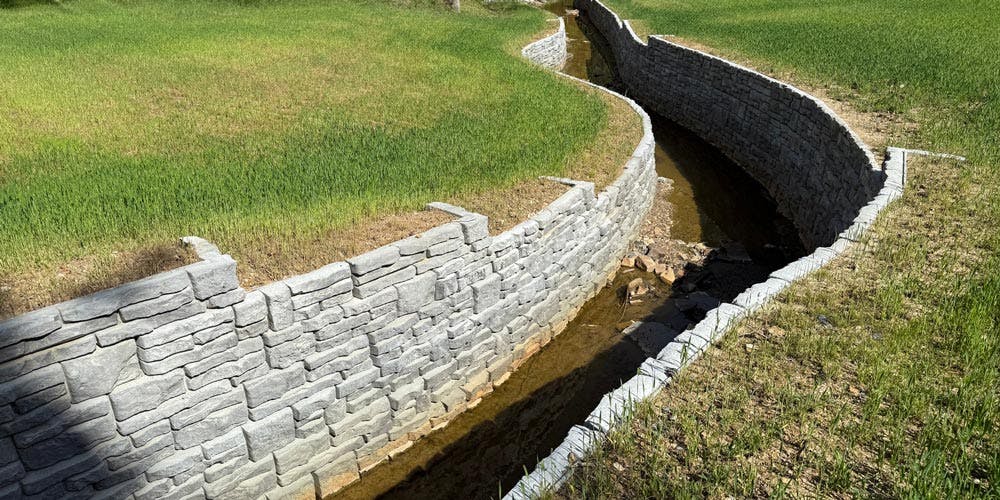 image of novum walls on both sides of stream