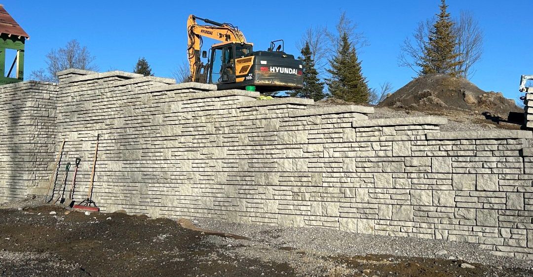 image of Novum alpine wall with excavator on slope