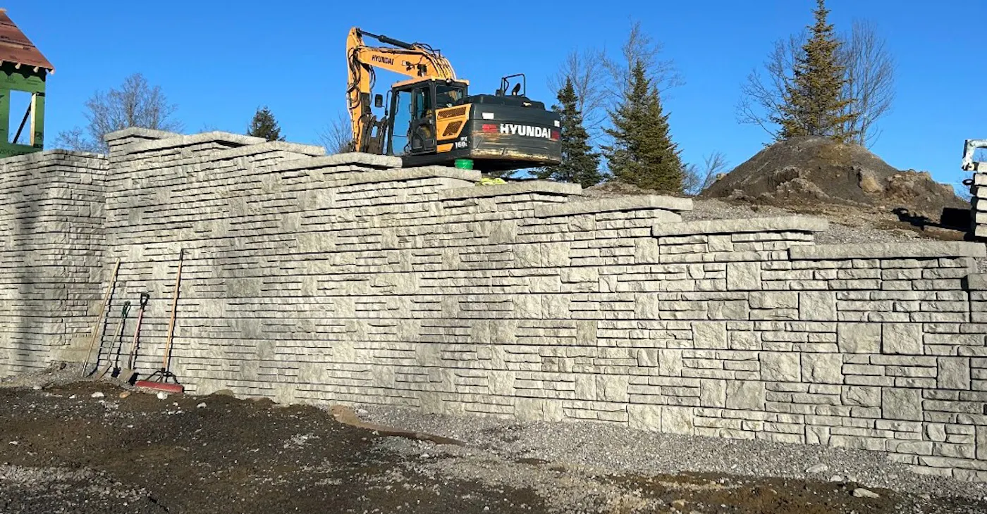image of Novum alpine wall with excavator on slope