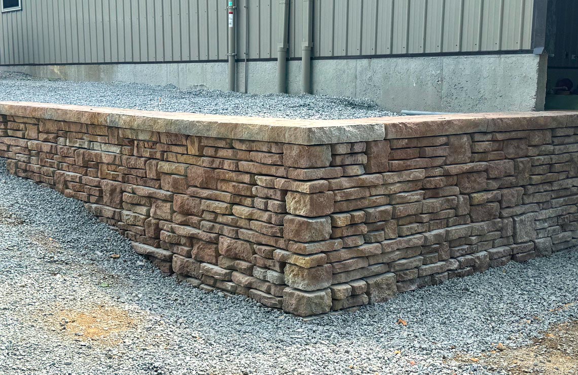 image of stained alpine textured novum wall in front of pole barn