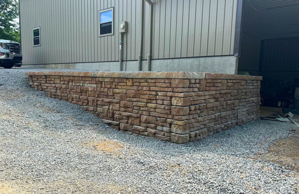 image of stained alpine textured novum wall in front of pole barn