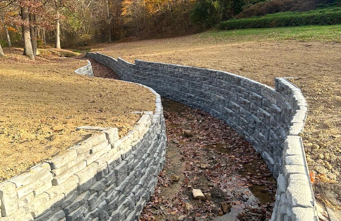 image of alpine textured novum walls on both sides of creek bed in Fall