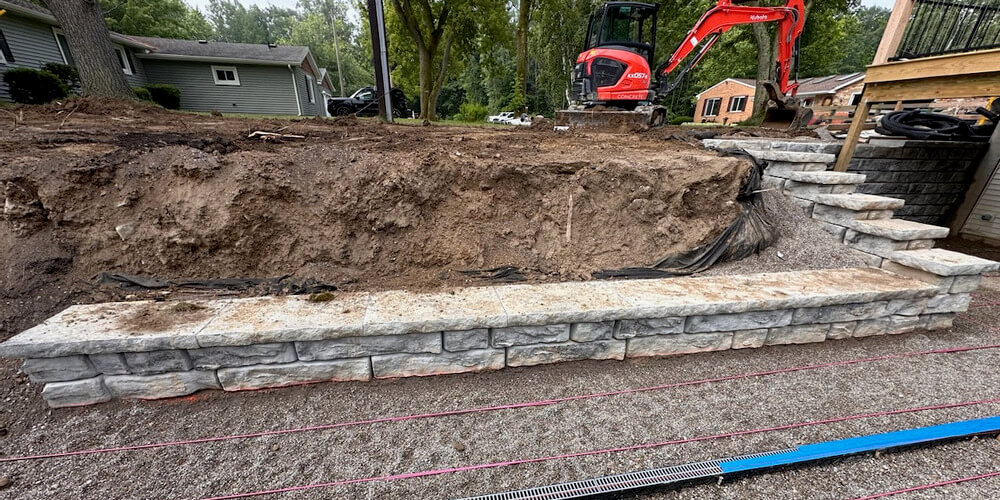 image of novum wall ridge textured wall being installed in backyard of home