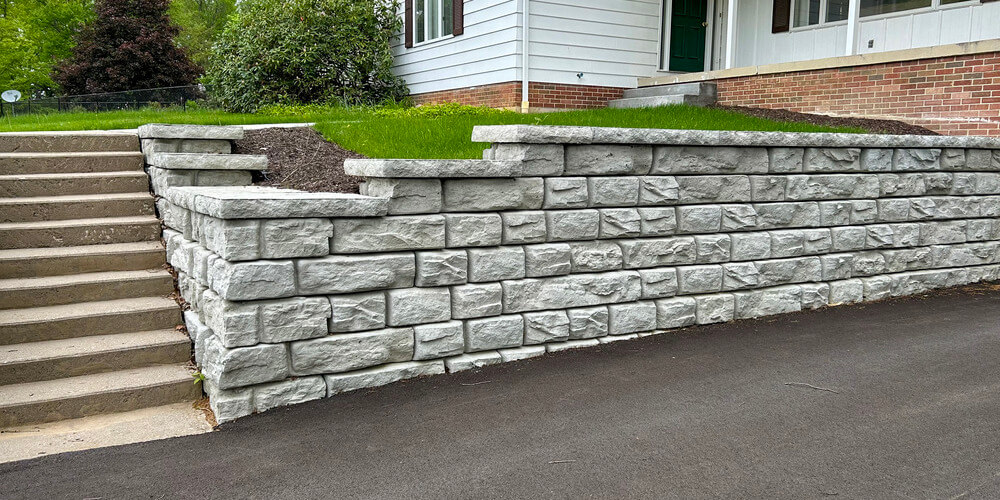 image of novum wall ridge textured wall for driveway with house in background