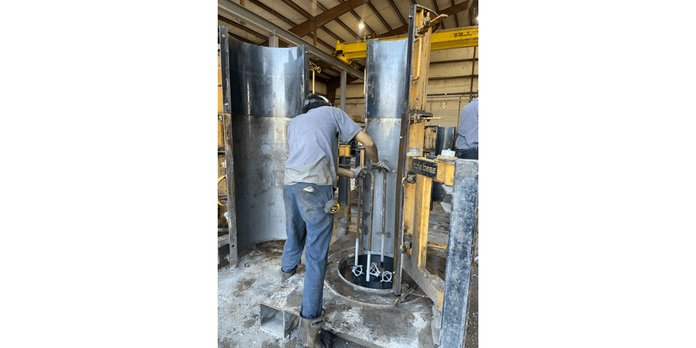 Anchor bolts are set into the base plate in preparation for pouring. 