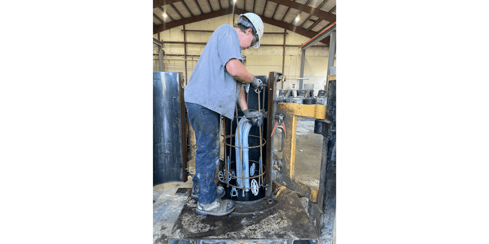 Conduit is placed on the interior sides of the Pole Base form with conduit magnets