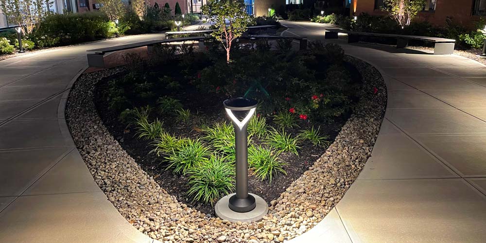 image of split walkway with pole base site lighting surrounding path