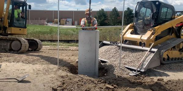Pole Base installation with excavator and skid steer