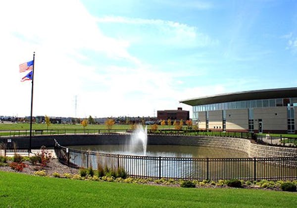 A retention pond with a fountain in the middle