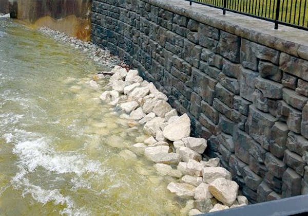 Ledgestone retaining wall creates structurally sound storm channel