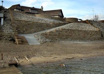 Ledgestone Walls Protect Home From Erosion