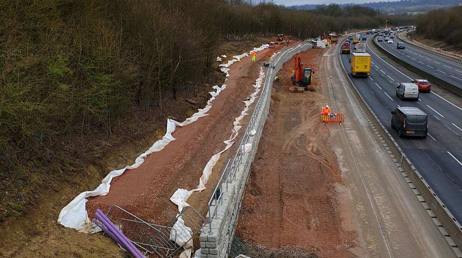 Retaining wall installation on side of highway