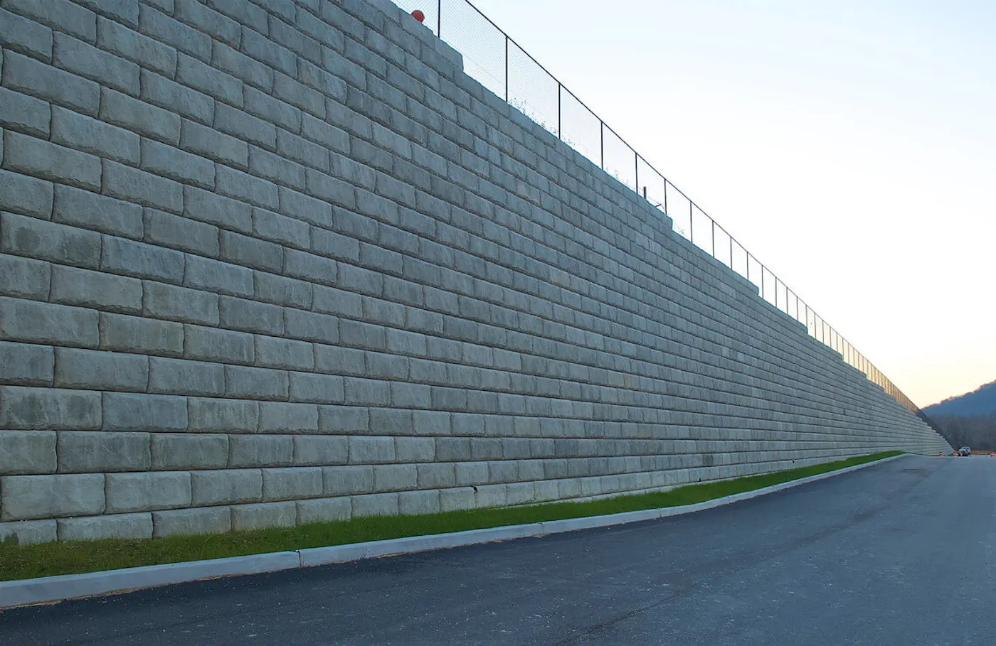 image of redi-rock limestone hybrid wall next to road
