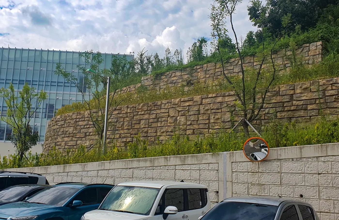 image of redi-rock wall next to parking lot