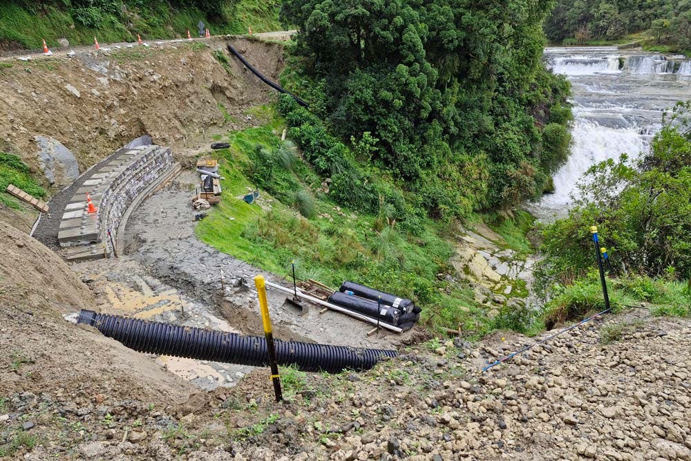 image of redi-rock wall being installed next to river