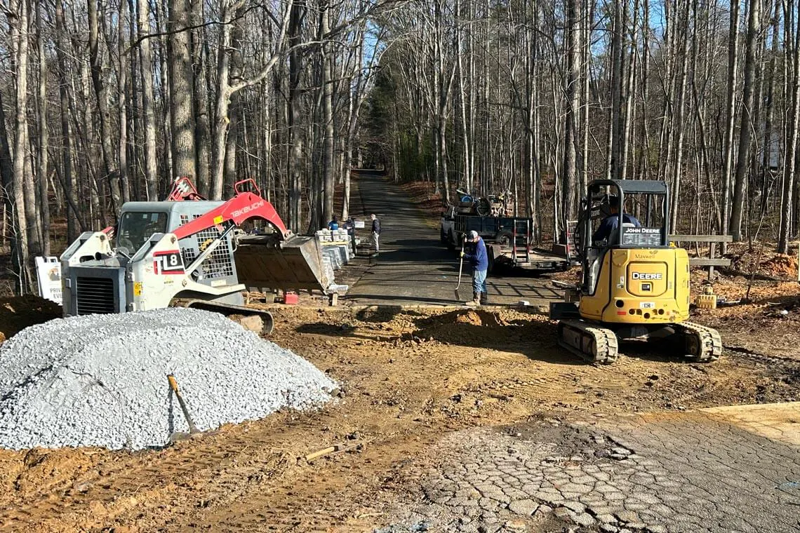 Base preparations begin for a Redi-Rock front entryway project.