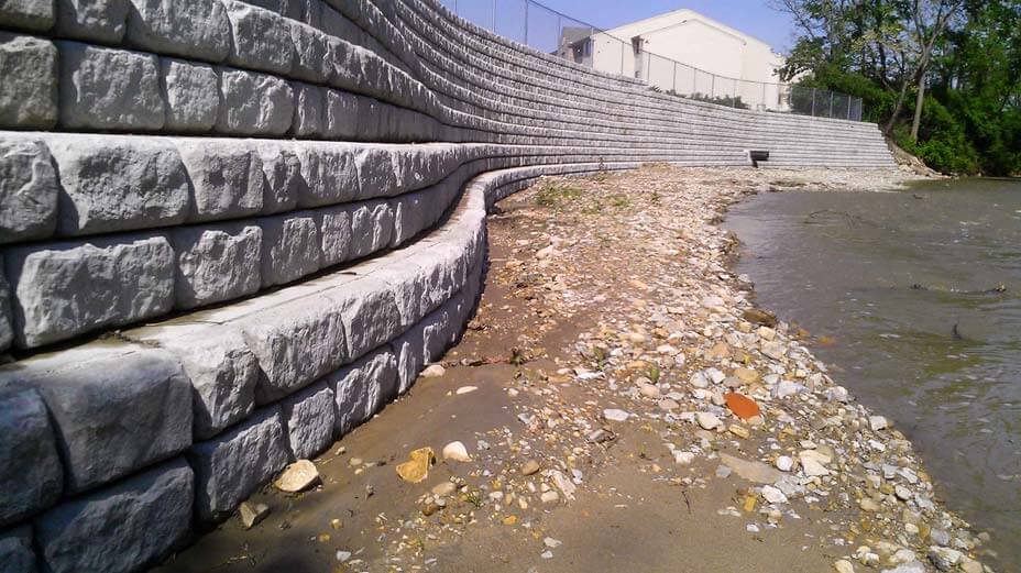 Curved Cobblestone retaining wall with setbacks for erosion control