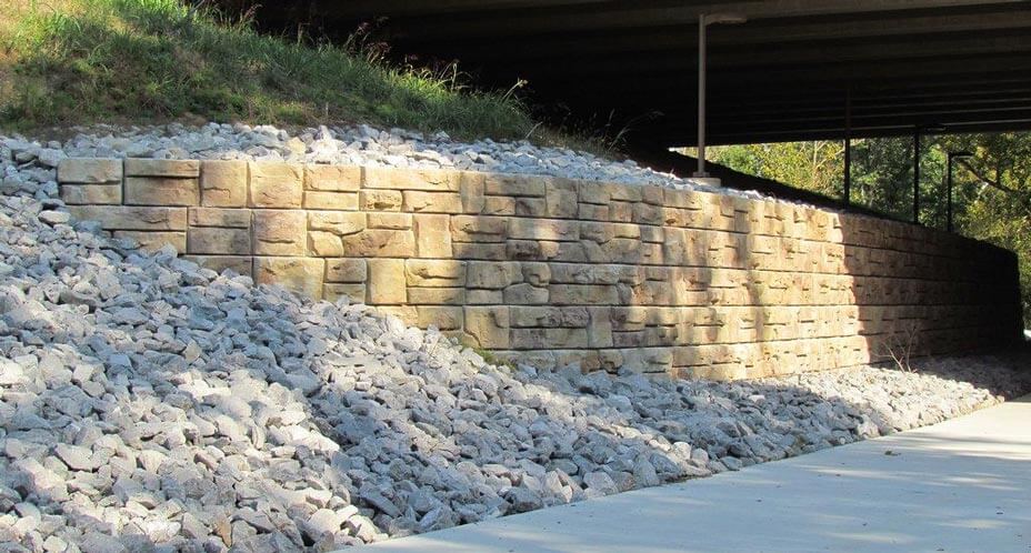 Ledgestone retaining wall provides stabilization to overpass