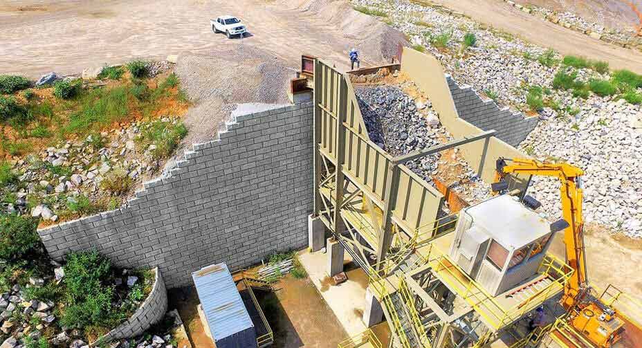 A 51-foot tall wall adjacent to a primary crusher at a quarry