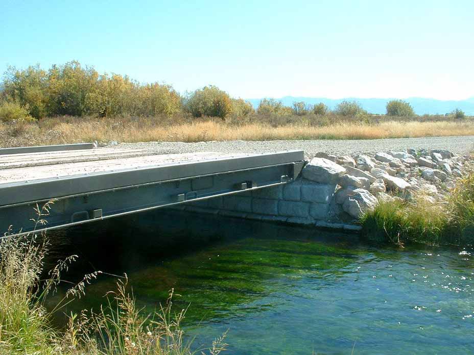 Cobblestone gravity blocks support small bridge