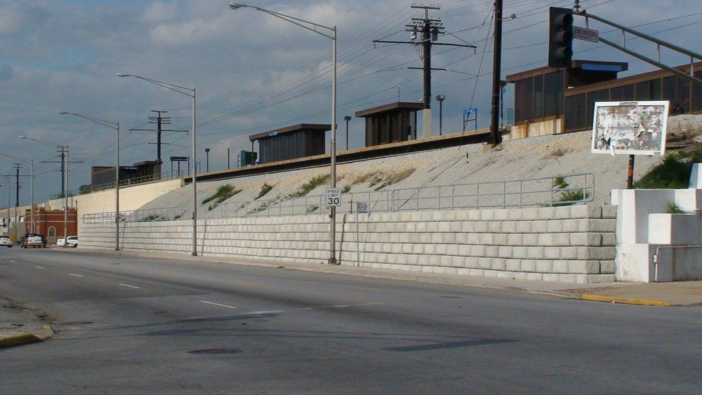 Limestone retaining wall below a Metra train station