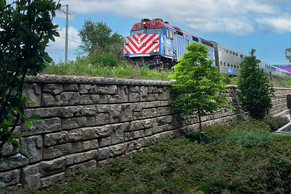 image of train above ledgestone redi-rock wall