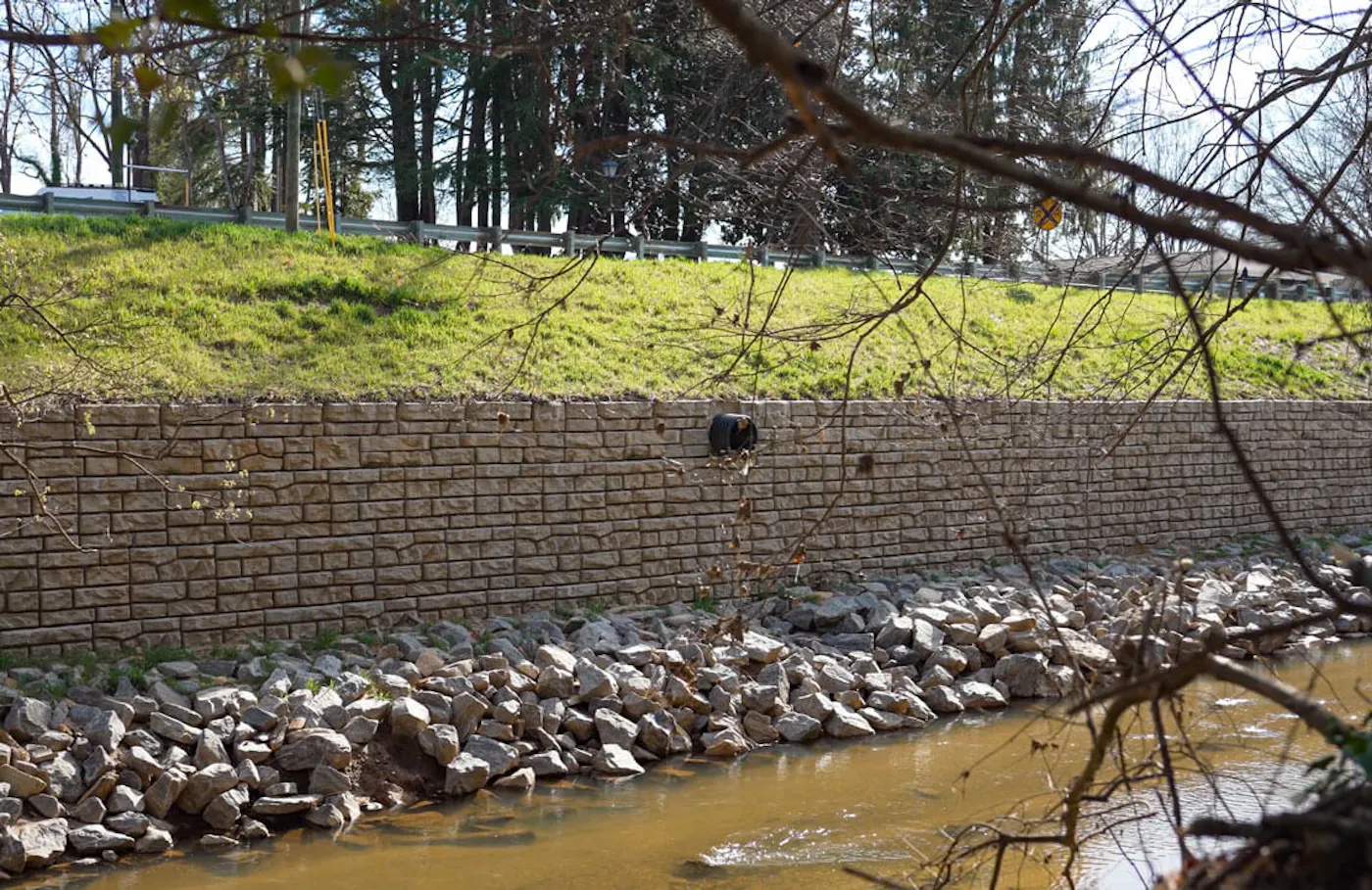 drone image of redi-rock ledgestone wall along river