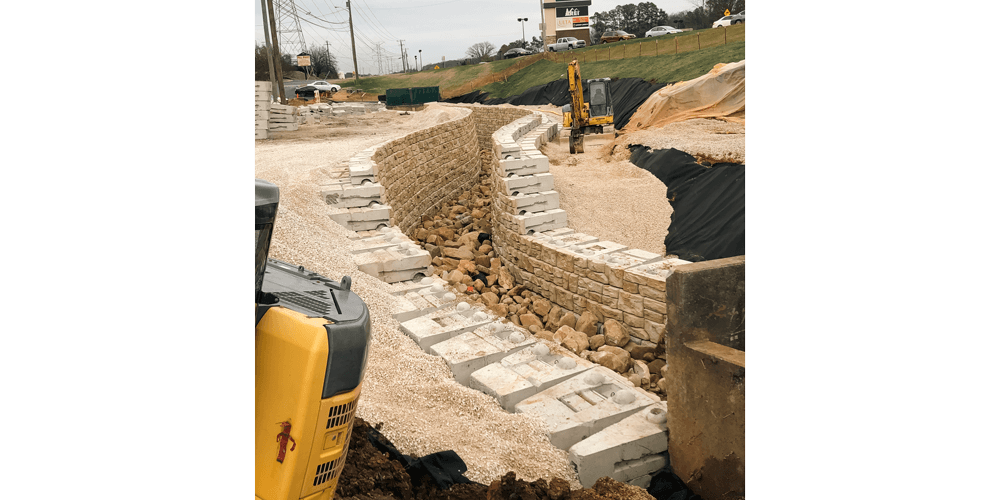 image of redi-rock blocks being installed on both sides of stormwater channel