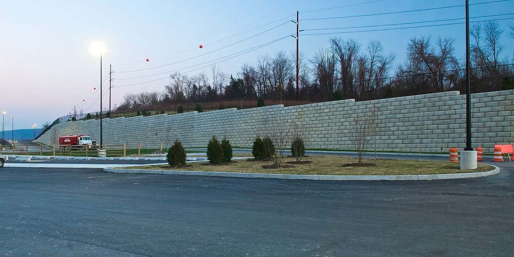 image of limestone textured redi-rock wall along road