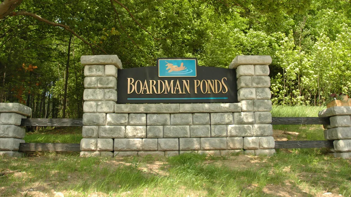 Redi-Rock cobblestone column blocks create a front entry sign for a residential development. 
