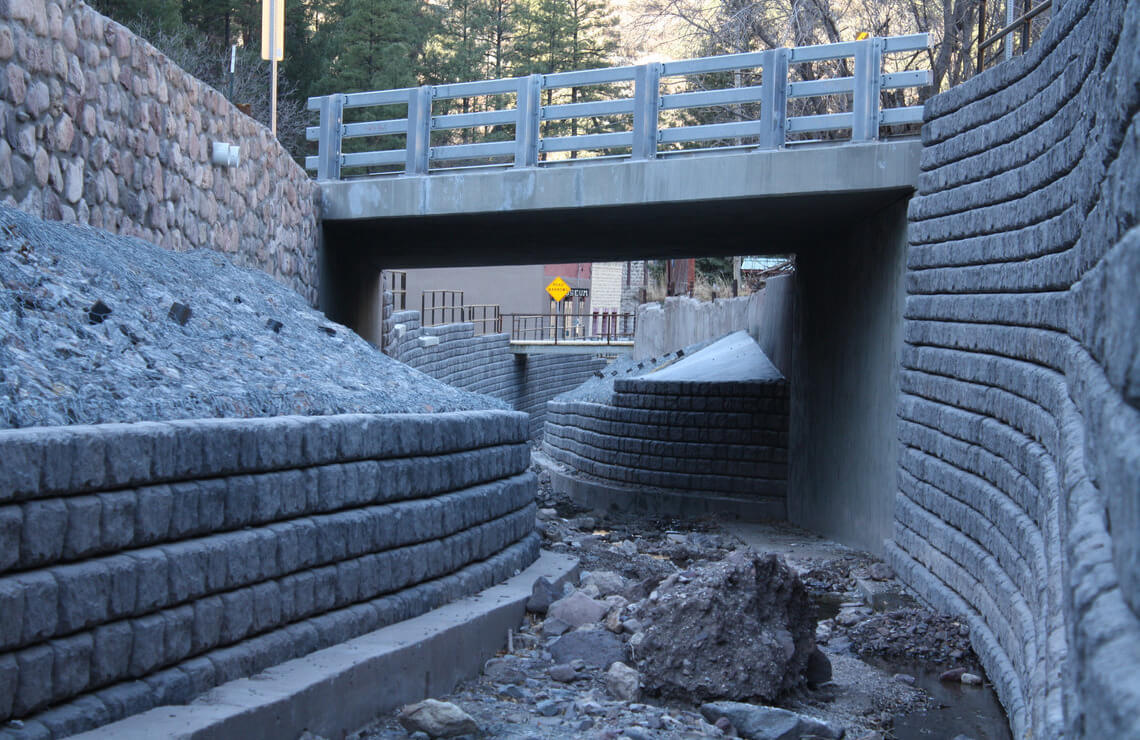 image of redi-rock cobblestone wall with bridge