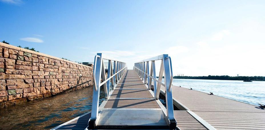 Riverfront dock with Ledgestone retaining wall protecting shoreline from erosion