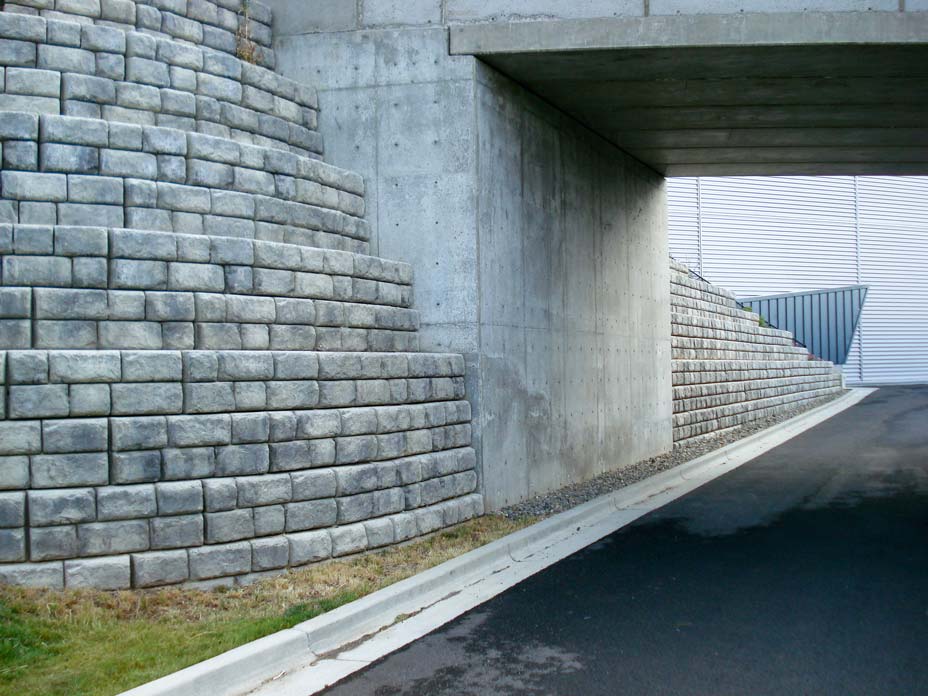 Tiered Cobblestone retaining wall with planter blocks