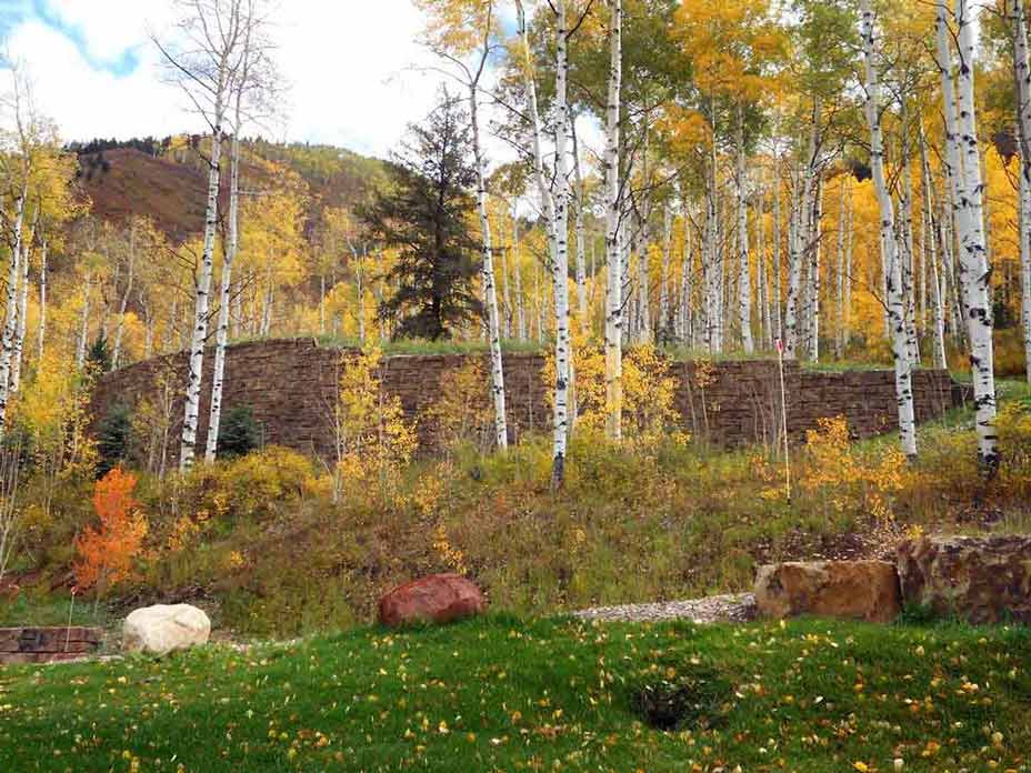 Tall Ledgestone gravity retaining wall providing support for Aspen residence