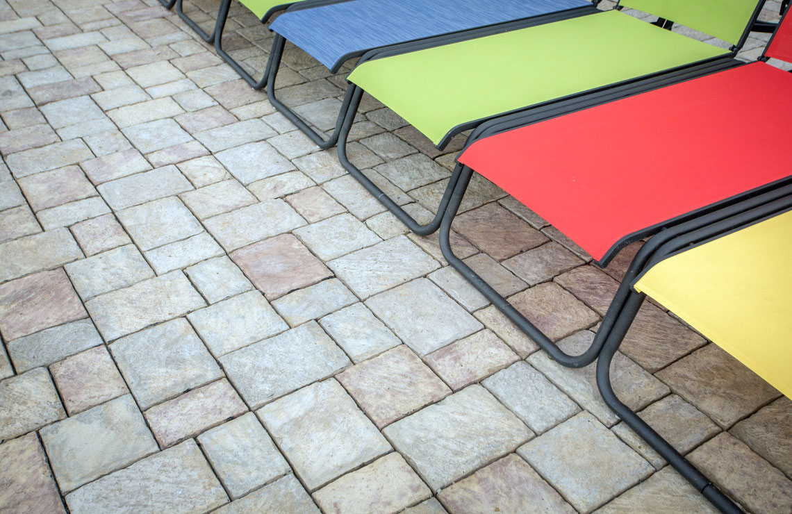 new mission pavers with different colored lounge chairs