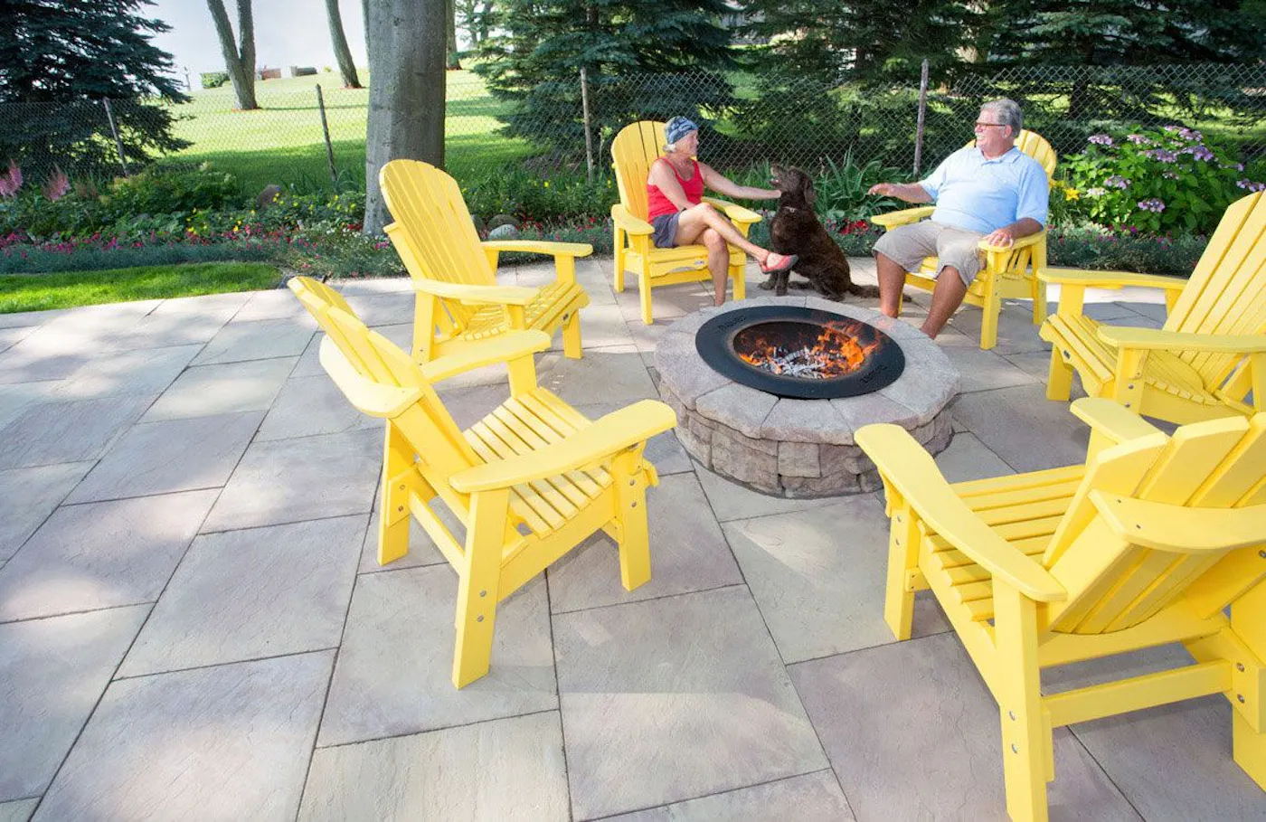 24x24 flagstone for fire pit area surrounded by yellow chairs