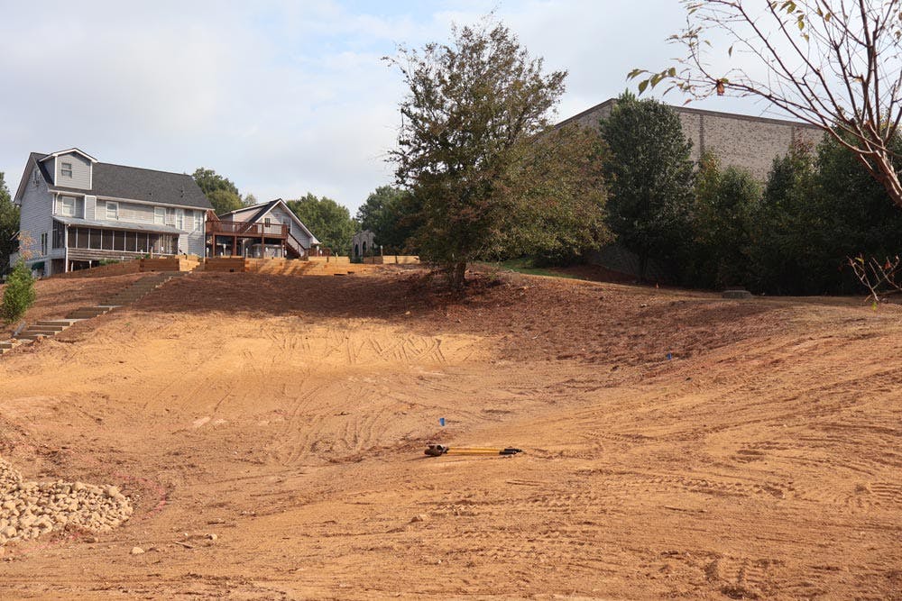 image of dirt yard behind house