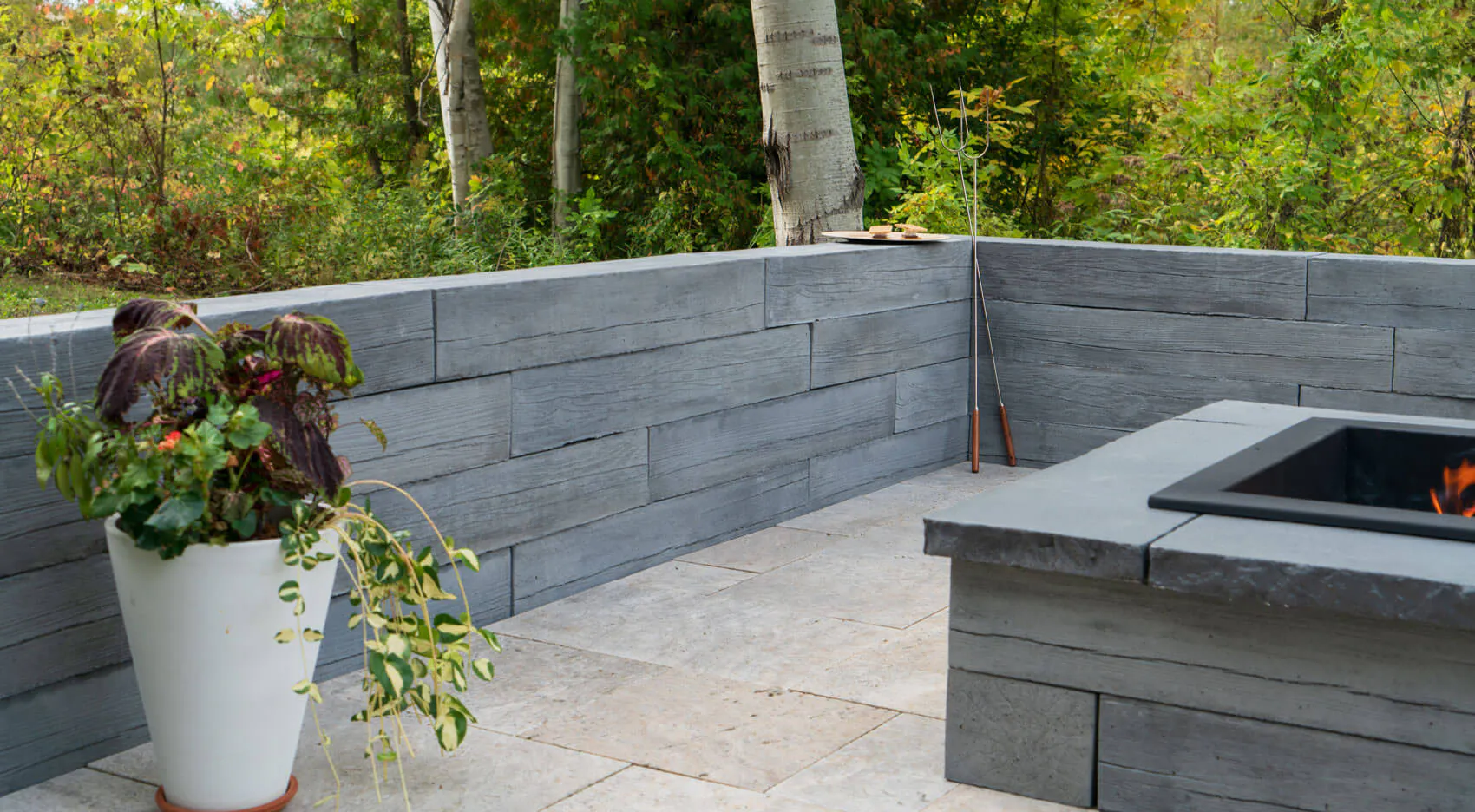 heartwood wall with vase and firepit
