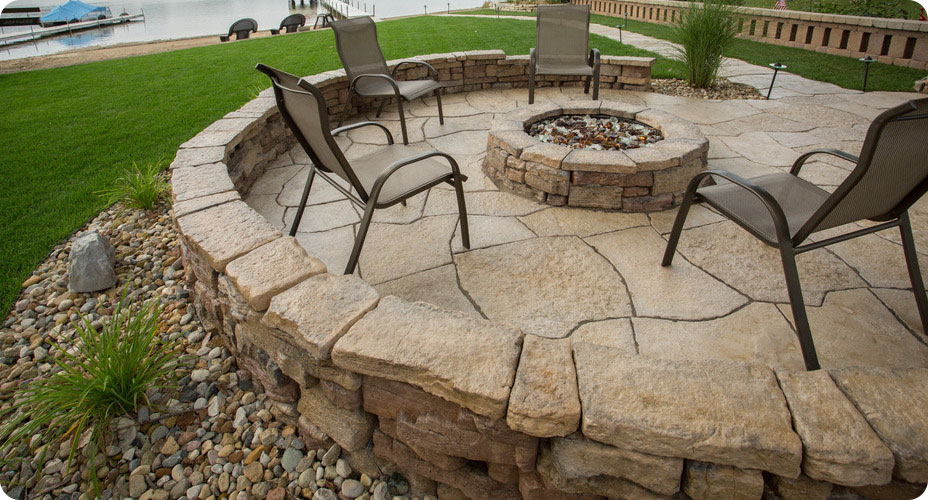 lakeside patio area with chairs belvedere firepit belvedere wall and belvedere coping