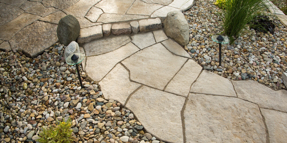 image of grand flagstone pavers for pathway lined with pebbles