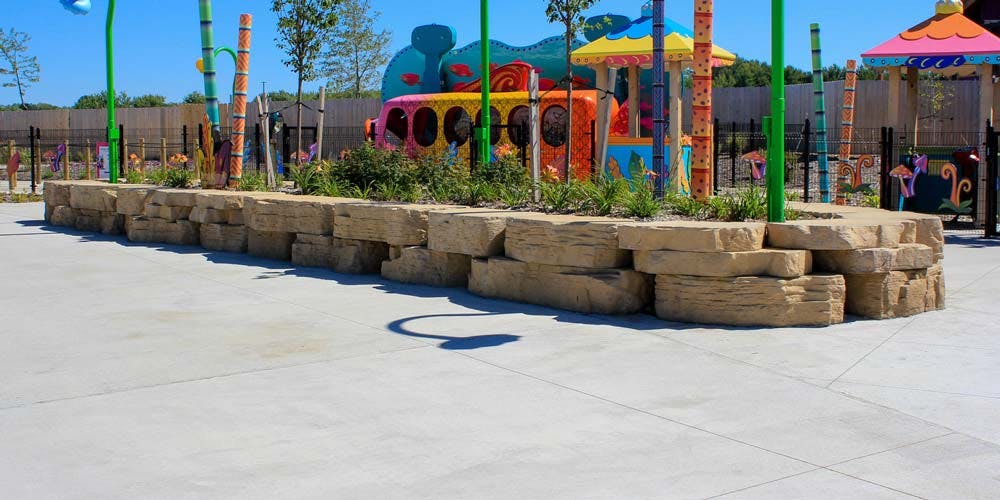 Outcropping Seat Walls Add Visual Interest to a Tropical Garden