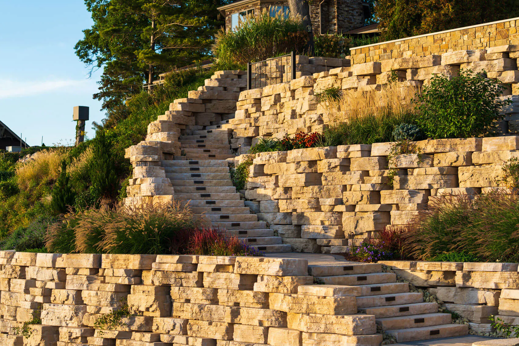 tiered outcropping walls with dimensional steps for home