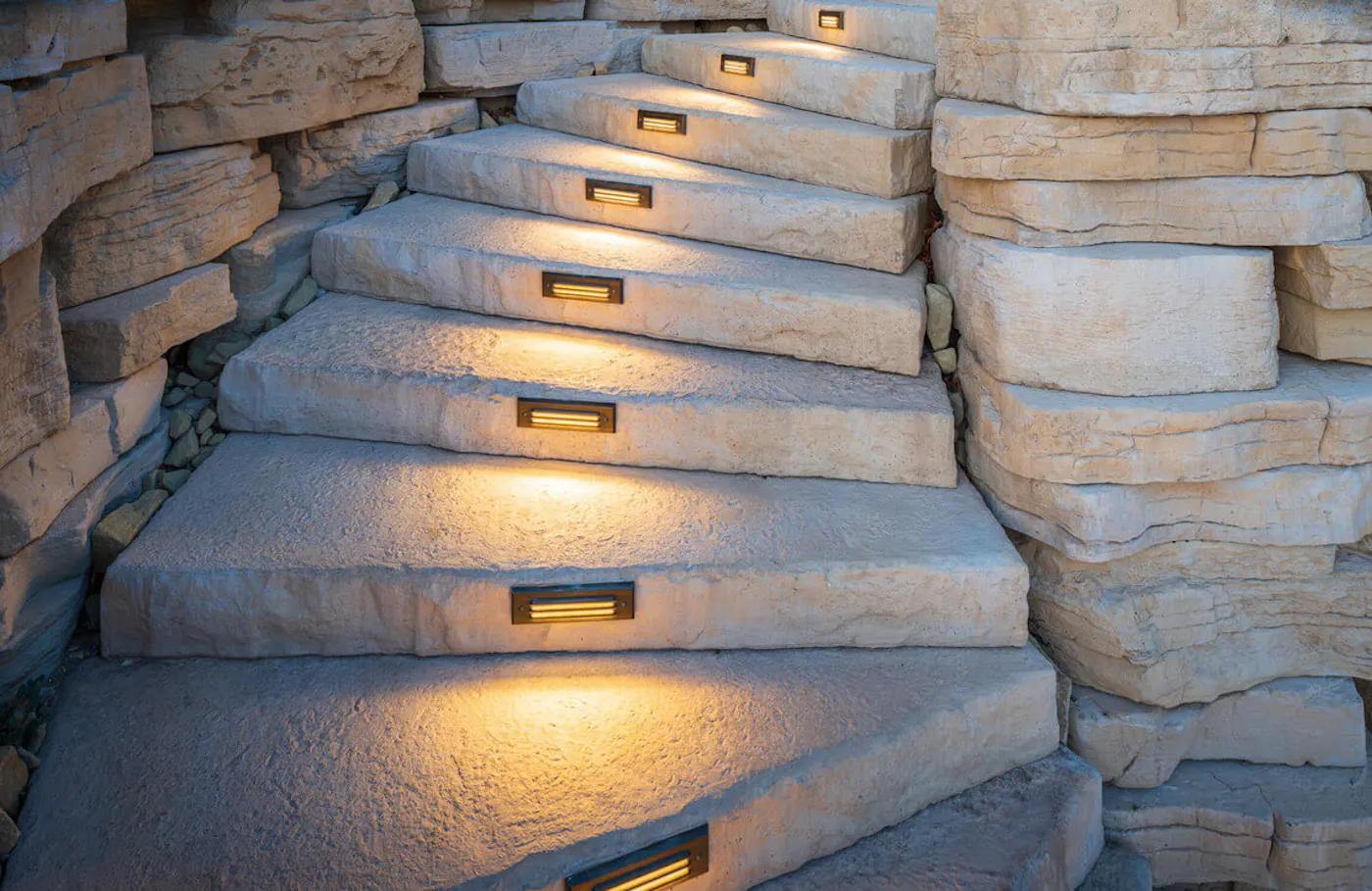 curved stairway of dimensional steps with lights on them